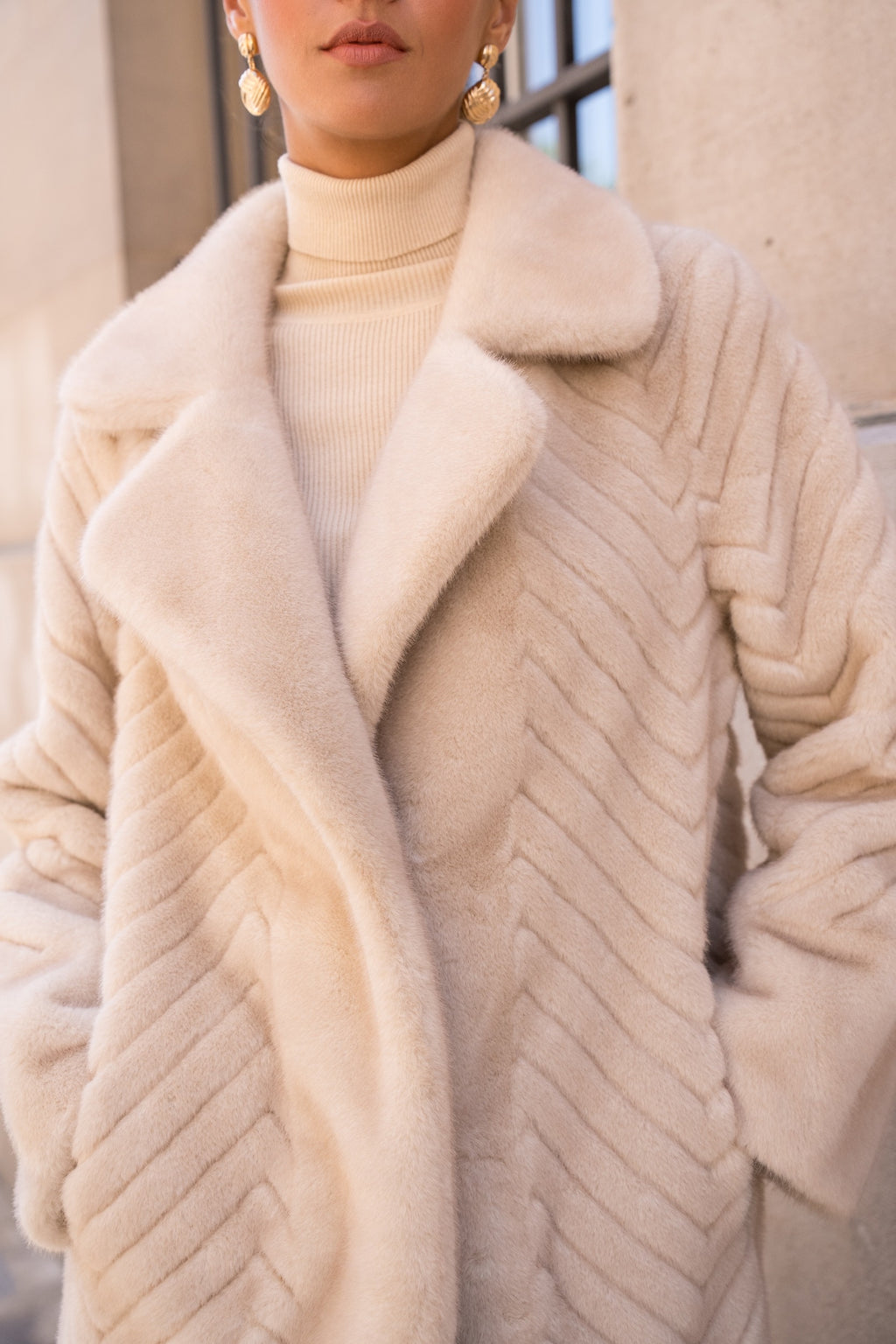 Manteau fausse fourrure